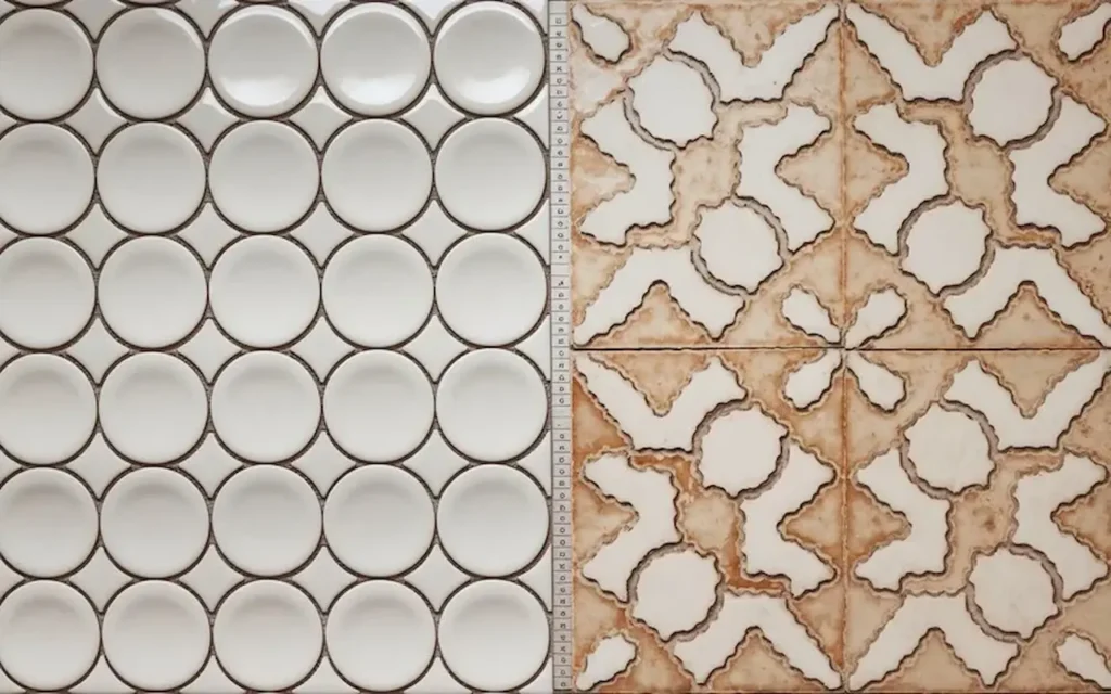 Sample display of round mosaic tiles and decorative patterned ceramic tiles.