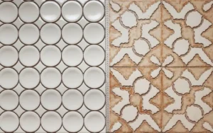 Sample display of round mosaic tiles and decorative patterned ceramic tiles.