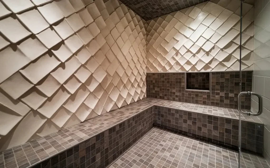 Modern walk-in shower with textured wall tiles and mosaic tile flooring.